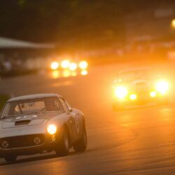 A Ferrari 250 GT SWB is chased by an Aston Martin DB4 GT as they race after the sunset. Taken by Nick Dungan for Goodwood
